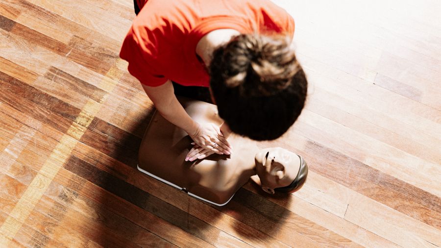 CPR instructor demonstrating training technique